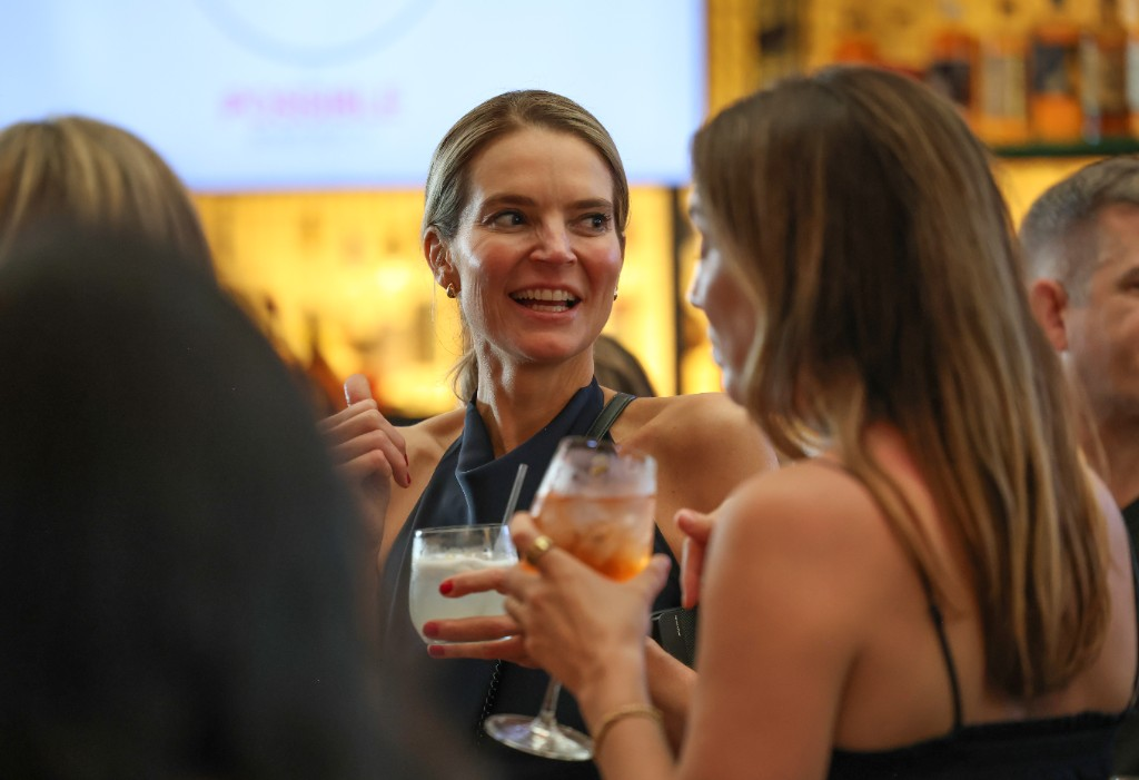Guests talking at a premium event bar