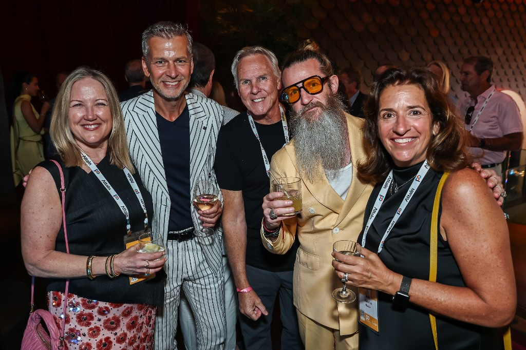 Event guests posing with drinks